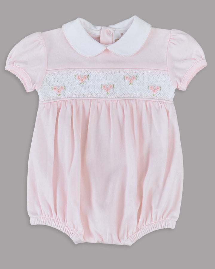 Romper rosa para bebê, delicado e encantador, perfeito para momentos especiais.