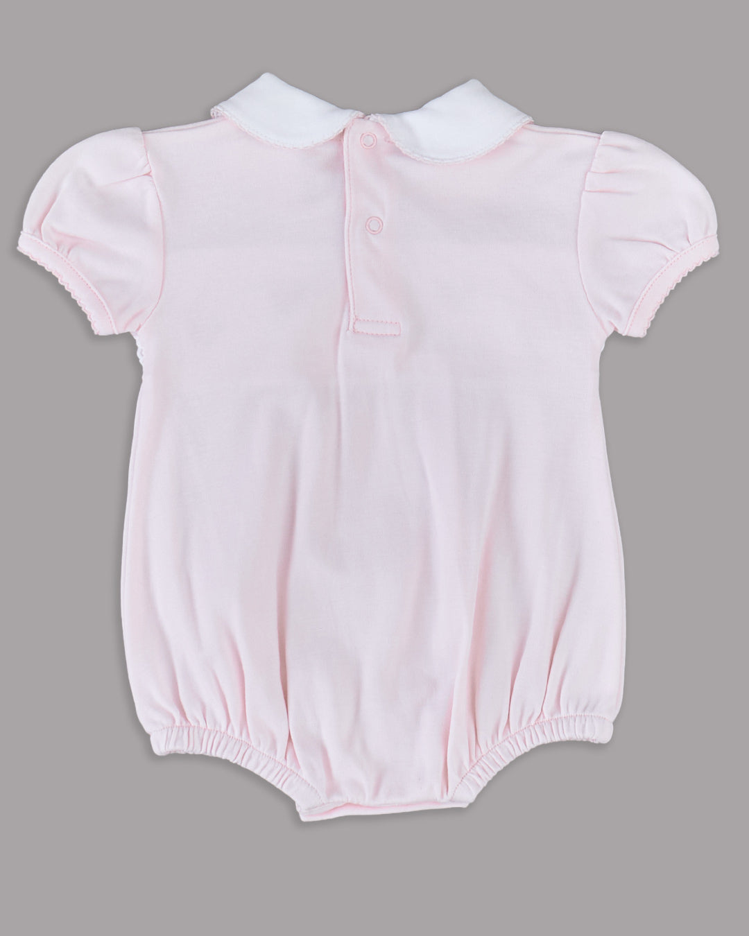 Romper rosa para bebê, delicado e encantador, perfeito para momentos especiais.